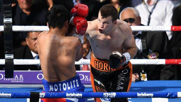 Man v mountain: Manny Pacquiao and Jeff Horn trade blows.  Photo: AAP
