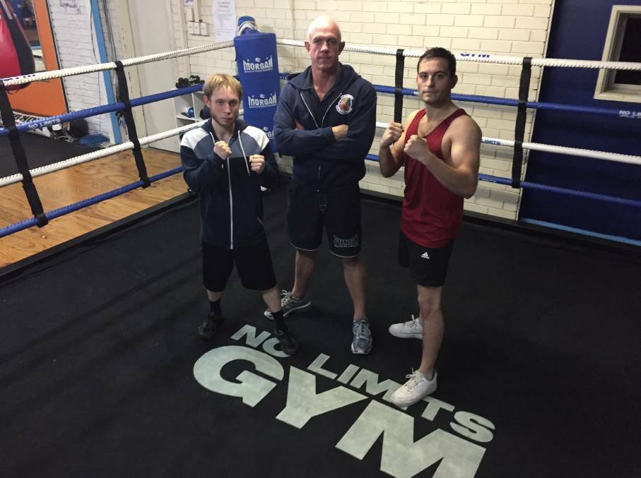 READY: Fighters Hayden Ford and Rhys Farmer with No Limits Gym owner and boxing coach Jason Naylor. The boxers will head to the novice titles this weekend.