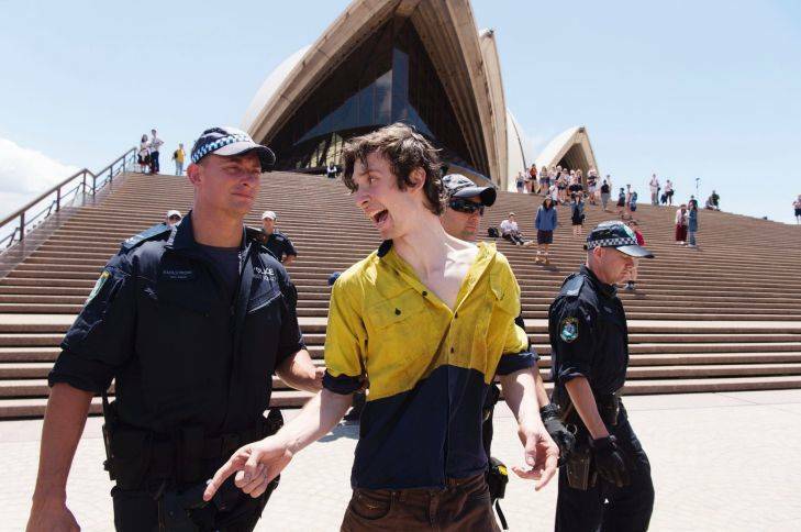 An activist is arrested outside Sydney Opera House. Picture: James Brickwood