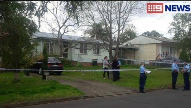 Police at the home in Miller, where a two-year-old girl was found dead on Tuesday.  Photo: Nine News Sydney