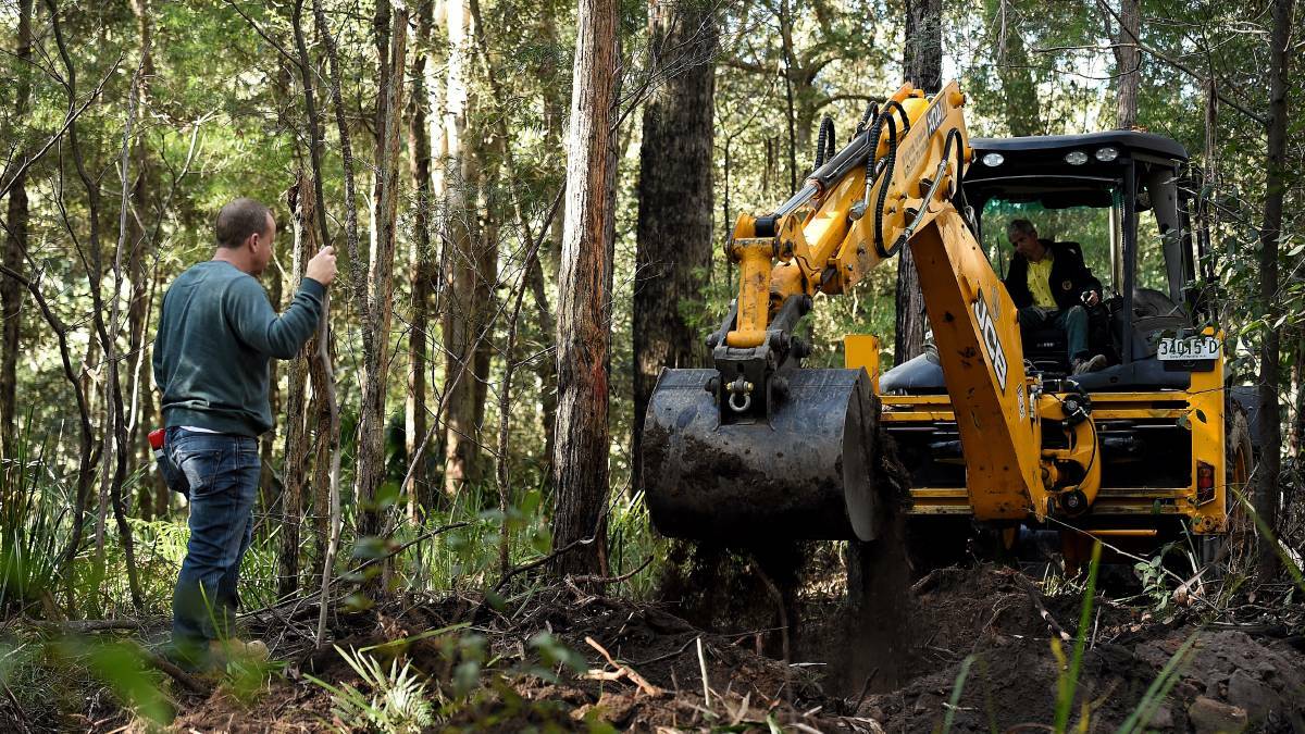 Fresh search: The digging resumes at the search area for the burial site of Matthew Leveson in the Royal National Park at Waterfall. Picture: Kate Geraghty