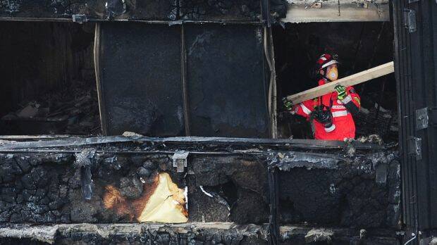 An London Fire Brigade officer inside the charred Grenfell Tower. Photo: PA