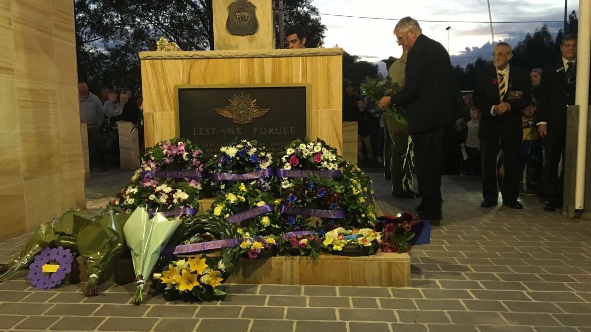 RESPECT: Many people laid wreaths and flowers at the Cenotaph during the dawn service in Seven Hills.