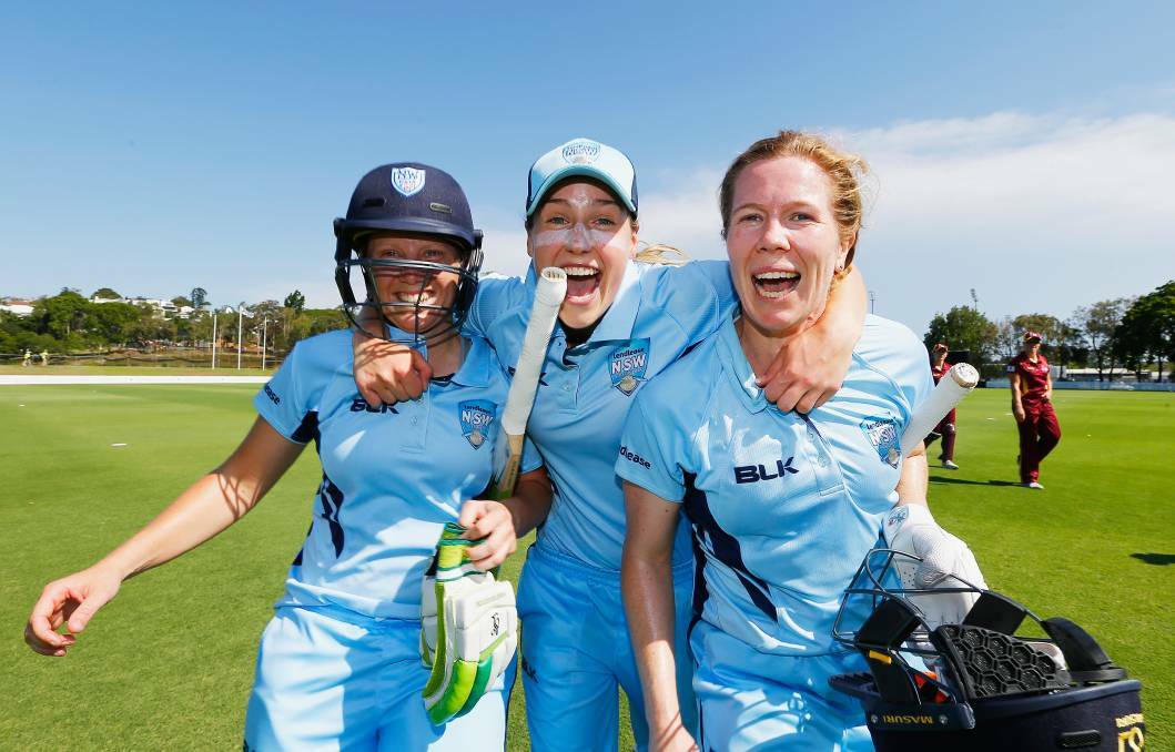 Alyssa Healy , Ellyse Perry and Alex Blackwell celebrate during the WNCL Final match betwee Queensland and New South Wales at Allan Border Field. Photo: Jason O'Brien/Getty Images