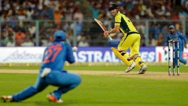 India's Ajinka Rahane takes a catch to dismiss David Warner. Photo: AP