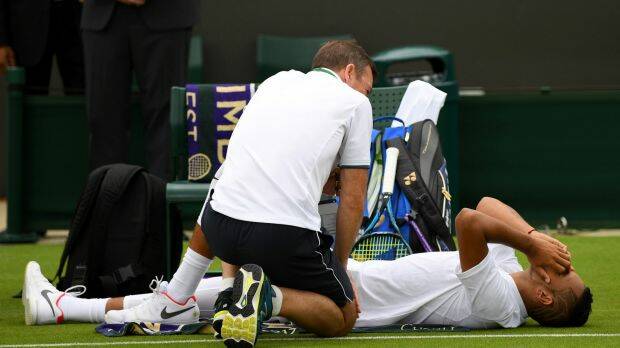 "Only 60, 65 per cent fit": Kyrgios receives treatment.  Photo: Shaun Botterill
