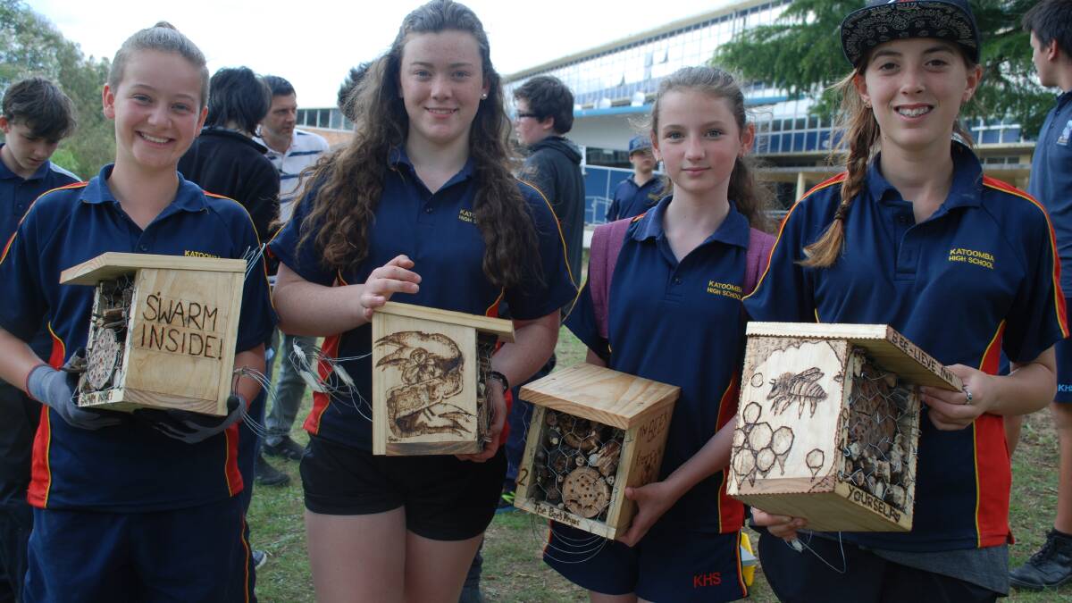 Miriam Nelson, Grace Mah, Celeste Arnold-Davis and Isabella Luken with their hand-made bee "hotels".