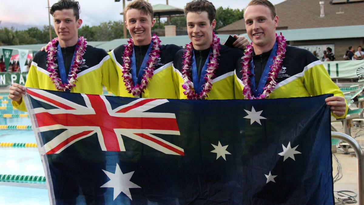 Silver: Matt Wilson (right) with the men's 4x100m freestyle relay team.