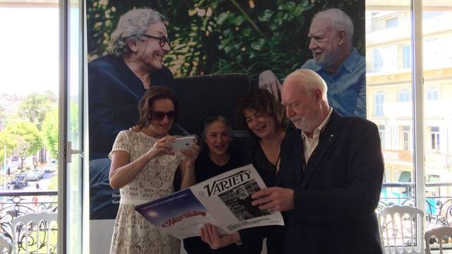 World stage: Director Sally Aitken, ABC executive producer Mandy Chang, Katoomba producer Jo-anne McGowan and Leura film legend David Stratton in the Screen Australia office in Cannes, reading their review in Variety.
