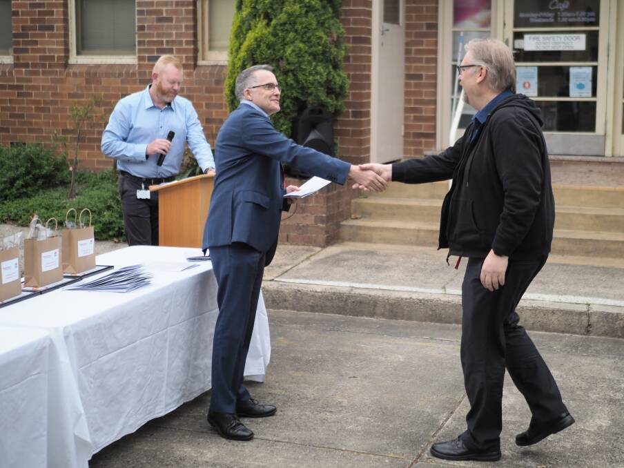 Lee Gregory (shaking hands at left) at a Blue Mountains Hospital reward and recognition ceremony where he congratulated staff for their hard work and dedication. Picture supplied