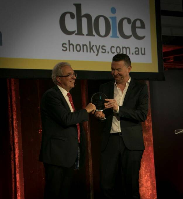 Leura resident Rod Stowe receives the Consumer Champion award from Choice CEO Alan Kirkland.