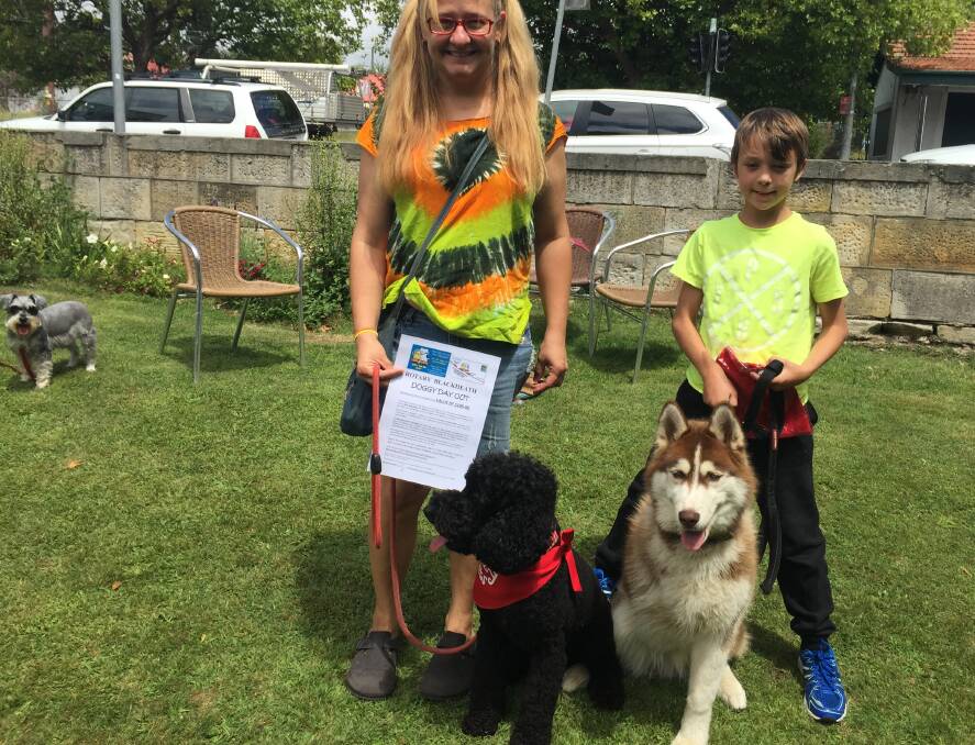 Grand champion: Best in show was Lucy, with owner Gee Kovats; three-legged husky Dare, with Harley Stephens, won an award for pluckiness.
