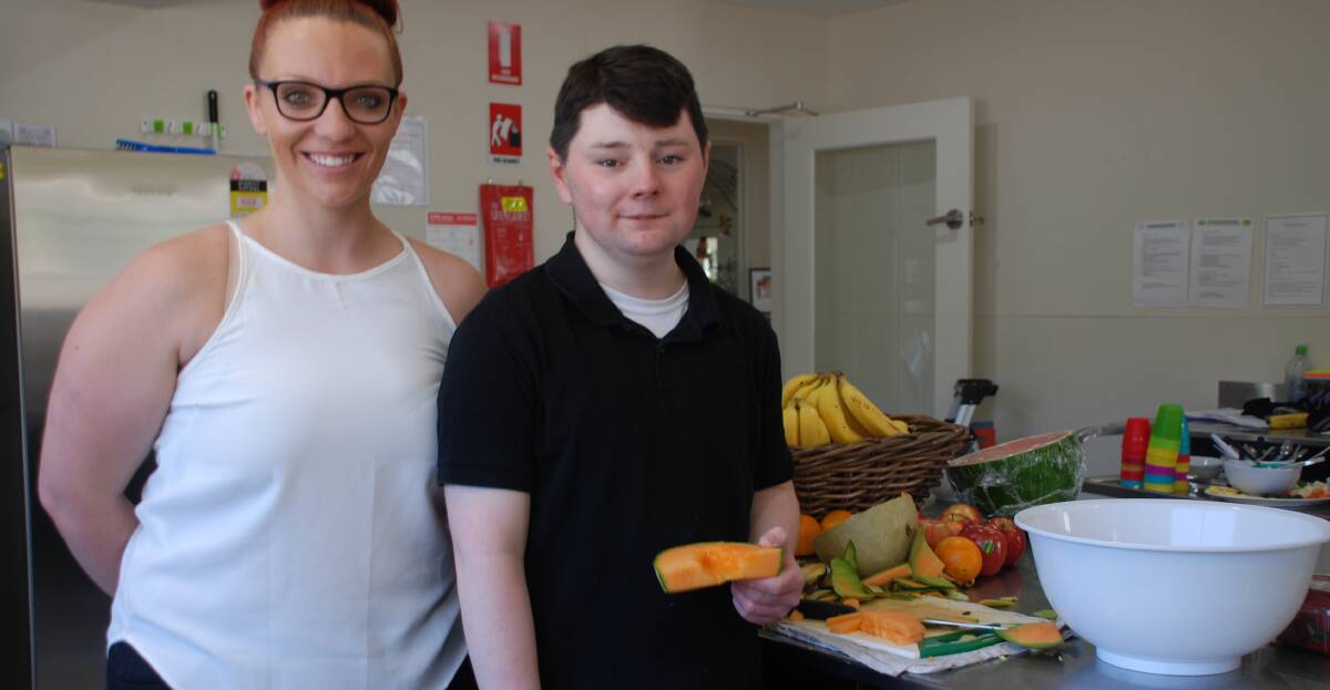 Impressed: Greenwood centre manager Samantha Stevenson with Cameron Jackson in the centre's kitchen.