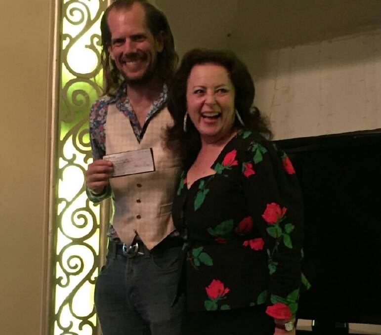 Robin Shannon from Kedumba Urban Farm, Katoomba receives the small producer grant cheque from Anne Elliott, from Slow Food Blue Mountains, at the Summer Harvest Festival and Wines of the West launch, held recently at The Carrington Hotel.