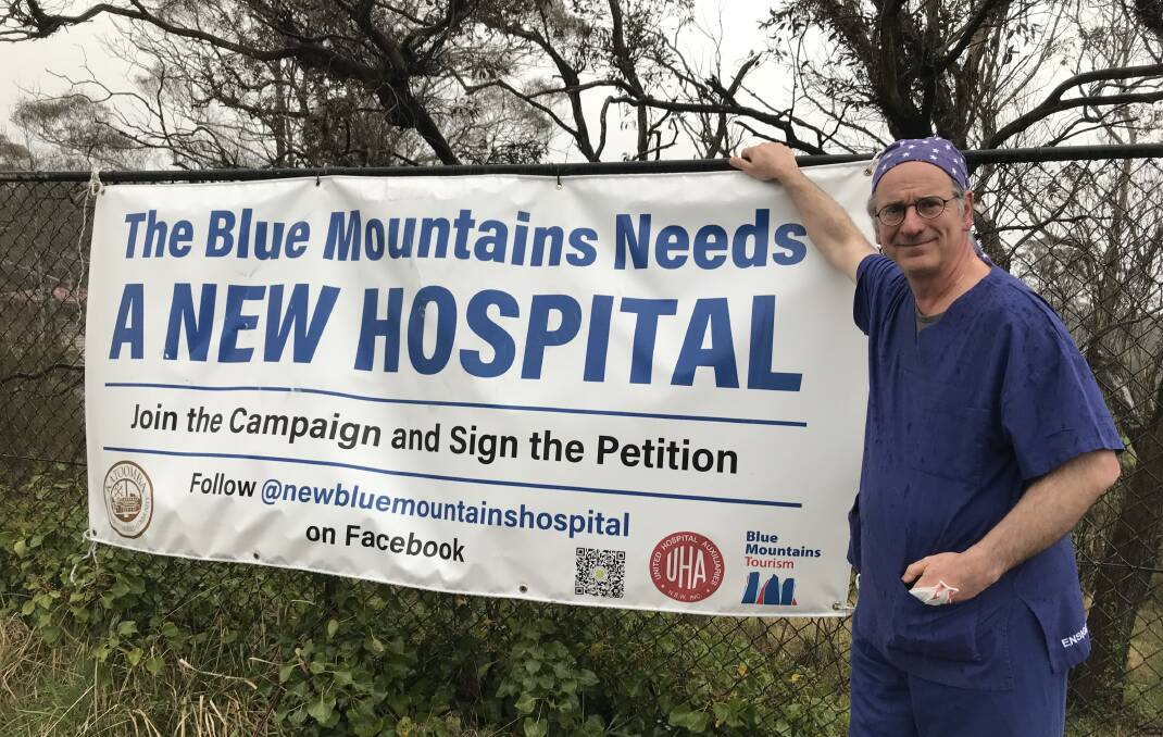 Dr Stavros Prineas, chairman of the hospital medical board, at the banner outside the hospital. File picture