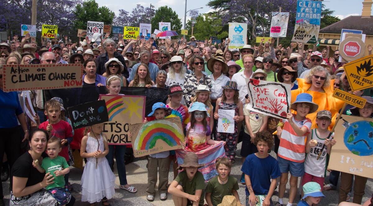 Day of action: Some of the crowd who gathered in Springwood on Sunday to urge politicians to take steps to mitigate the effects of climate change.