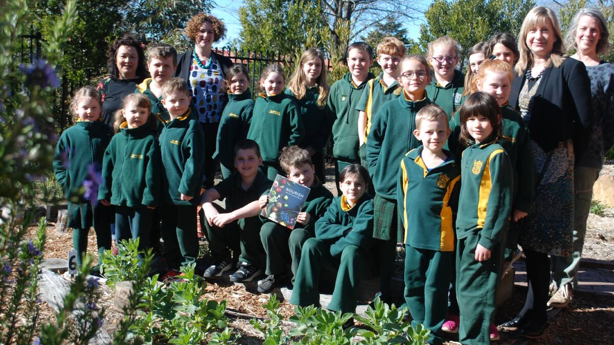 Blackheath students with parents Jody Lee, Sam Masters and Hannah Surtees (far right) with principal Jane Davies (second from right) in the school's community garden.