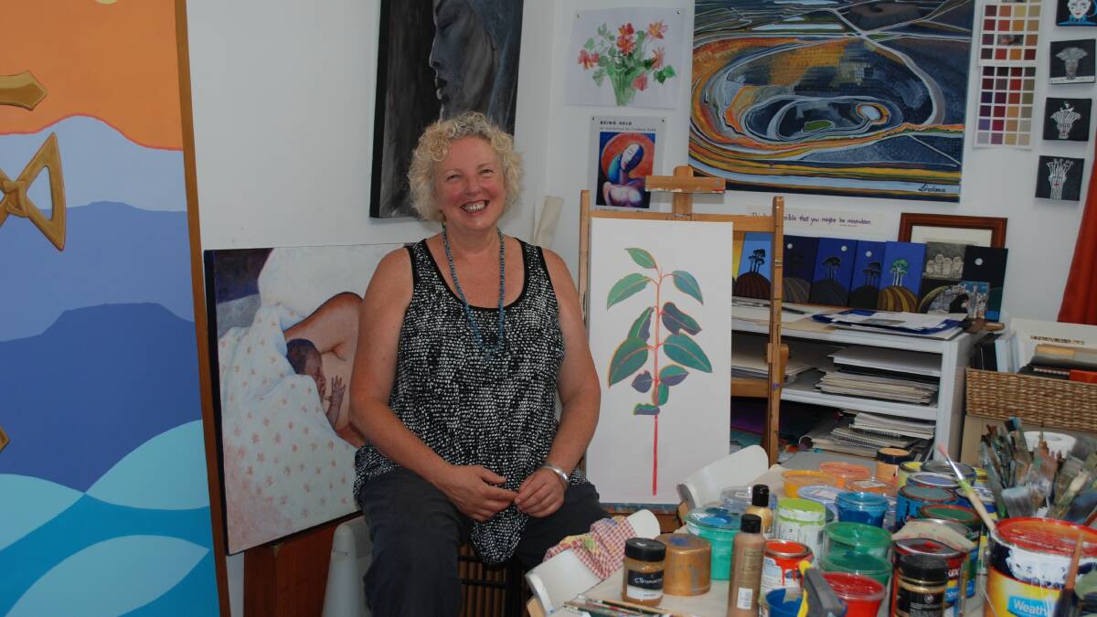 At home: The artist in her Blackheath studio. The panel partly seen on the left is now part of a mural at St Patricks Public School in Lithgow.
