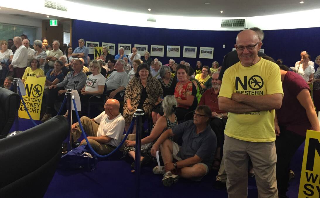 Full house: Roger Hennessy from Residents Against Western Sydney Airport (right) found himself a prime front-row spot at the meeting, although he did have to stand.