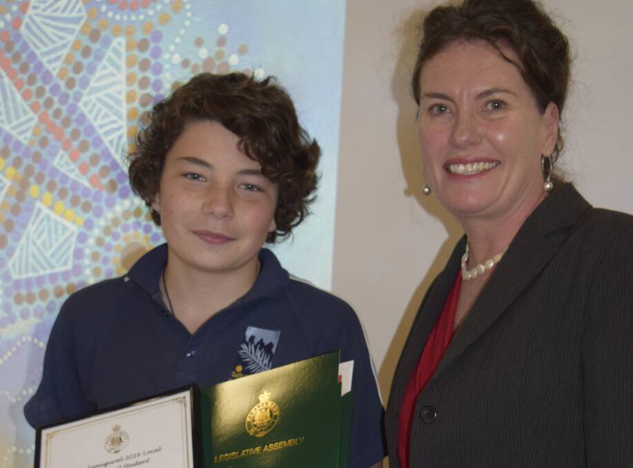 2016 local Aboriginal student of the year award, Kurtis Rule, is presented his award by Blue Mountains MP, Trish Doyle. 