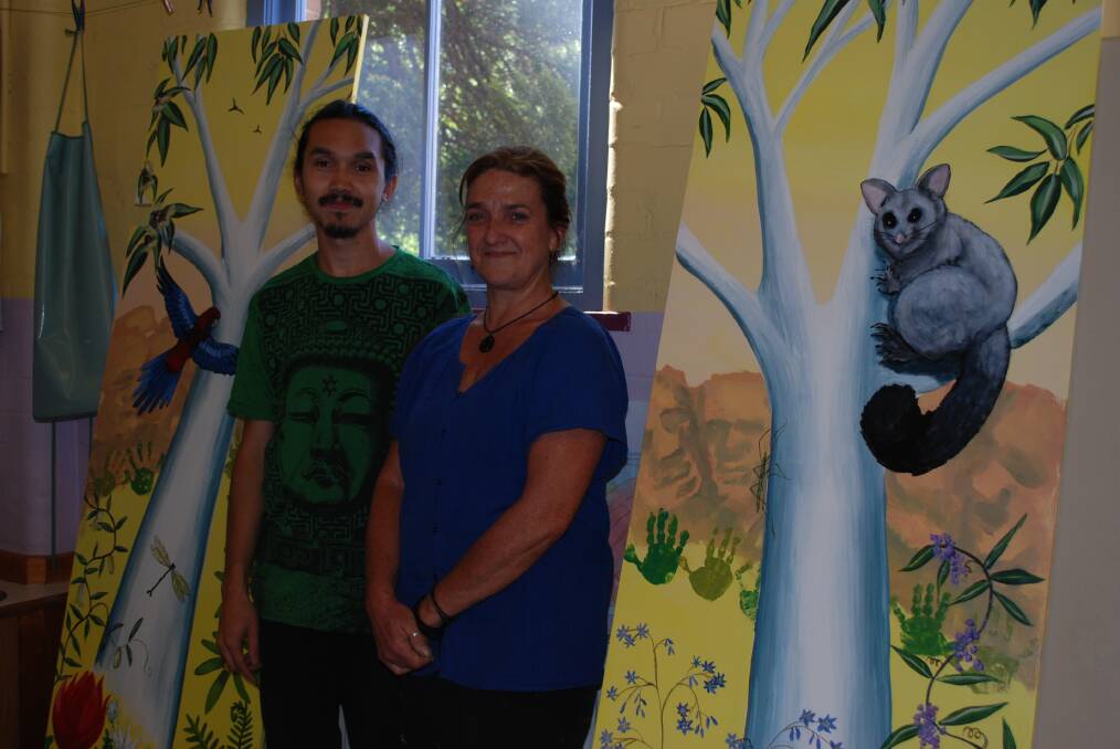 Leanne Tobin and her son, Shay, with the new doors for the Blackheath Montessori Centre pre-school.