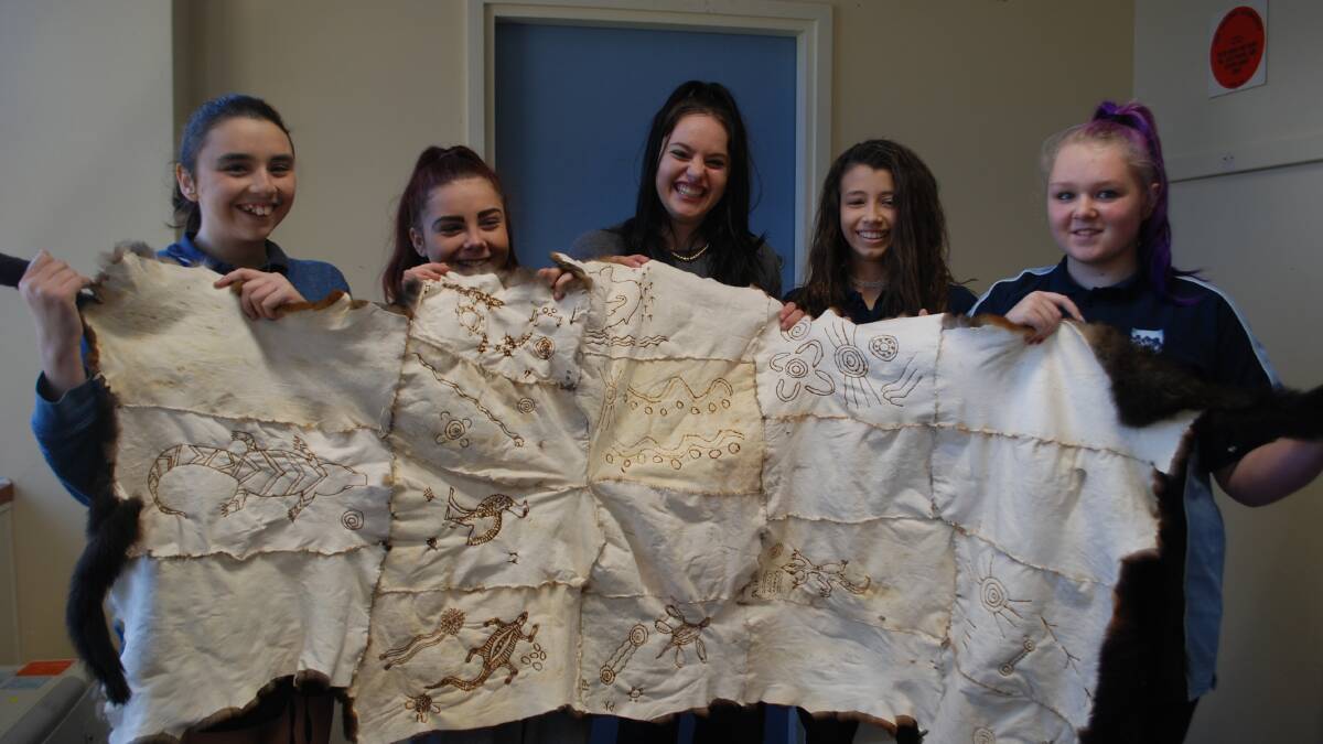 Katoomba High students: Phoebe Knox, Ellie-May Glover, Teisha Lee, Chloe Ryan and Abbie Cohen with the possum cloak they are making.