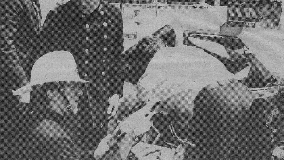 Gaut (in helmet) attending a series car accident in Parramatta in 1982.