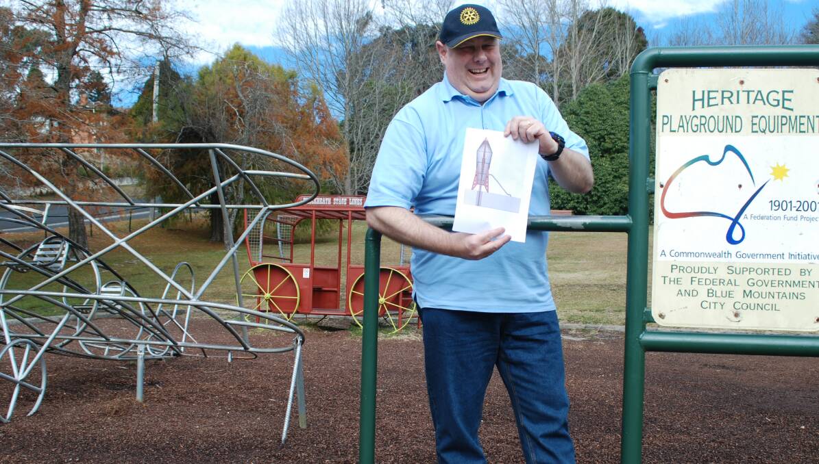 Blast off: Blackheath Rotary Club president, Andrew Hancock, with a drawing of the proposed new rocket for the Memorial Park.