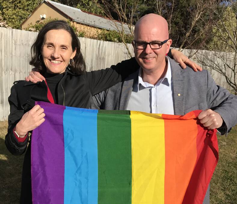 Yes vote campaign: Cr Romola Hollywood, who is on council's IDAHOT committee, with the mayor Mark Greenhill and a rainbow flag.
