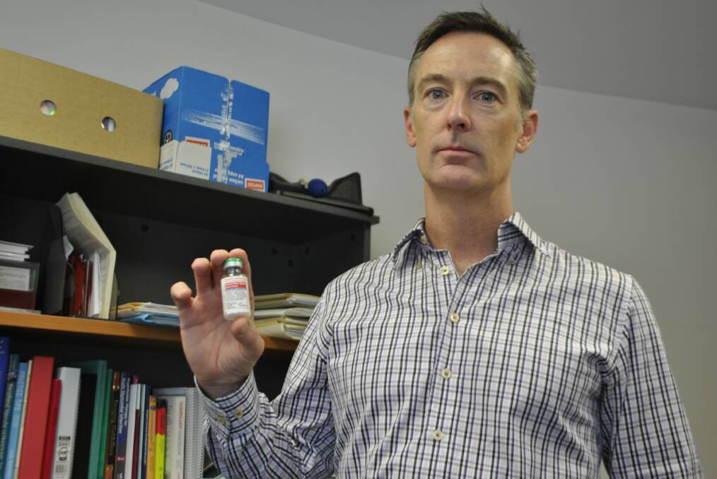 Bowral and District Hospital's Dr Matthew Bragg with a vial of anti-venom. 