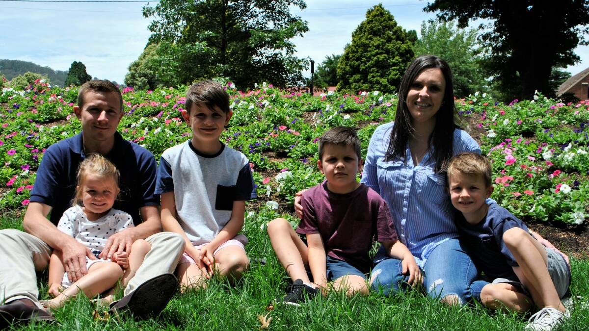 Riley (in the maroon shirt) pictured with mum Kayla, dad Stephen, brothers Brayton and Hudson and sister Henley.  