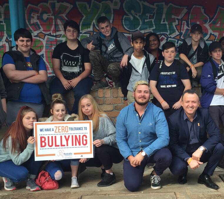 CYBER SMART: Bully Zero Foundation Australia leader Oscar Yildiz (front right) and PDHPE teacher Josh Wilson with students at Blacktown Youth College in Hebersham.