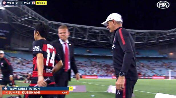 Unhappy: Jumpei Kusukami snubs Josep Gombau's handshake offer during the Wanderers victory over Melbourne City Photo: screengrab
