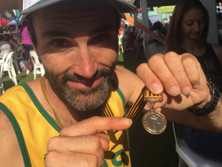 Finished!: Brendan Davies with the Wally Hayward medal he received for those runners who finished the Comrades Marathon under six hours but outside the top 10.