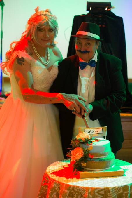 Celebration: Noel and Debi​ Pope prepare to cut the cake.​ Photo: David Camilleri