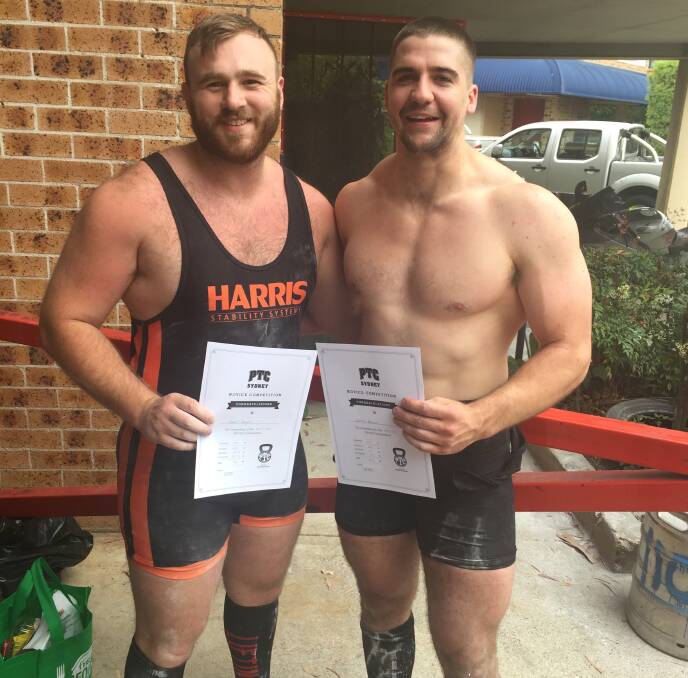 Strong men: Clint Taylor and Gavin Brown with their certificates after the Redemption Powerlifting Competition.
