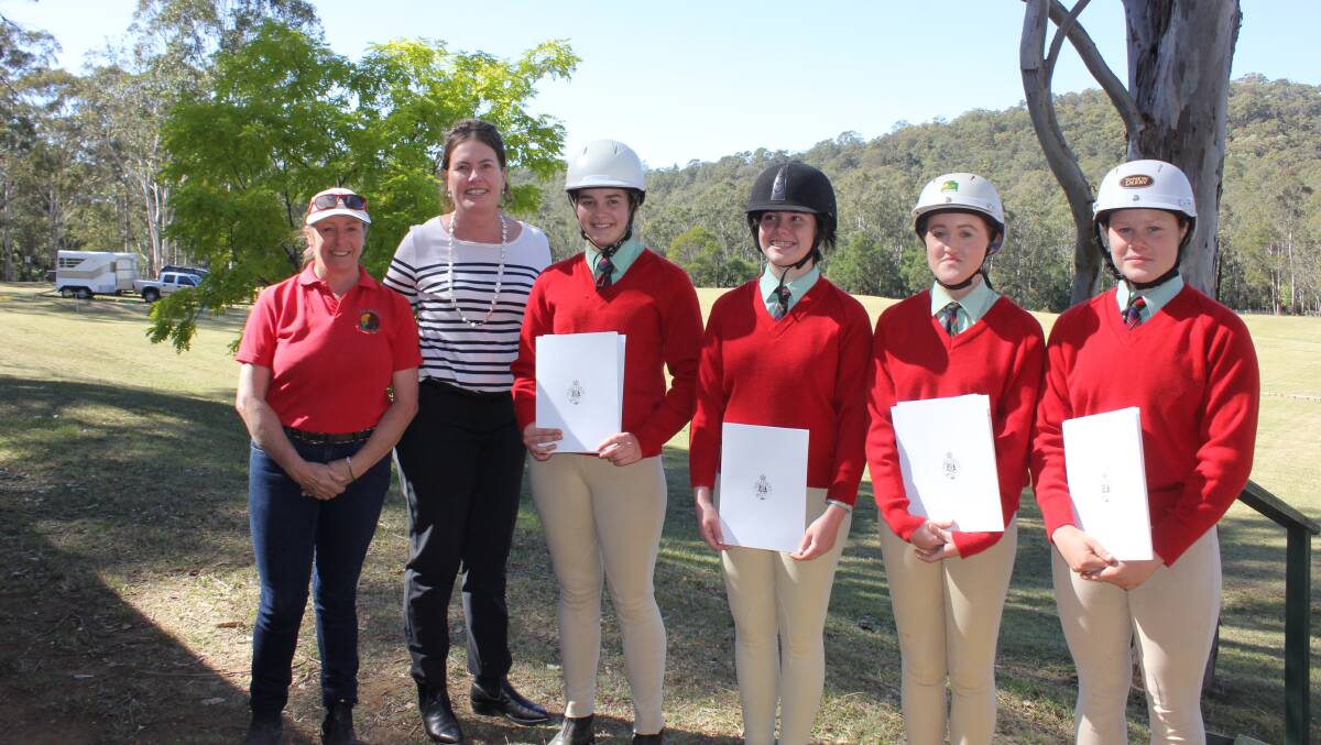Riding talent: Sun Valley Pony Club trainer Britt Moss with Member for Blue Mountains Trish Doyle and State Representative Award recipients at Sun Valley Reserve.