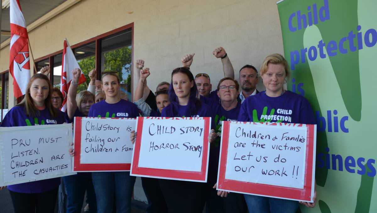 Put children first: Department of Family and Community Services workers from the Faulconbridge office on Thursday with Troy Wright from the Public Services Association, are frustrated at a new system they say is putting children at risk.