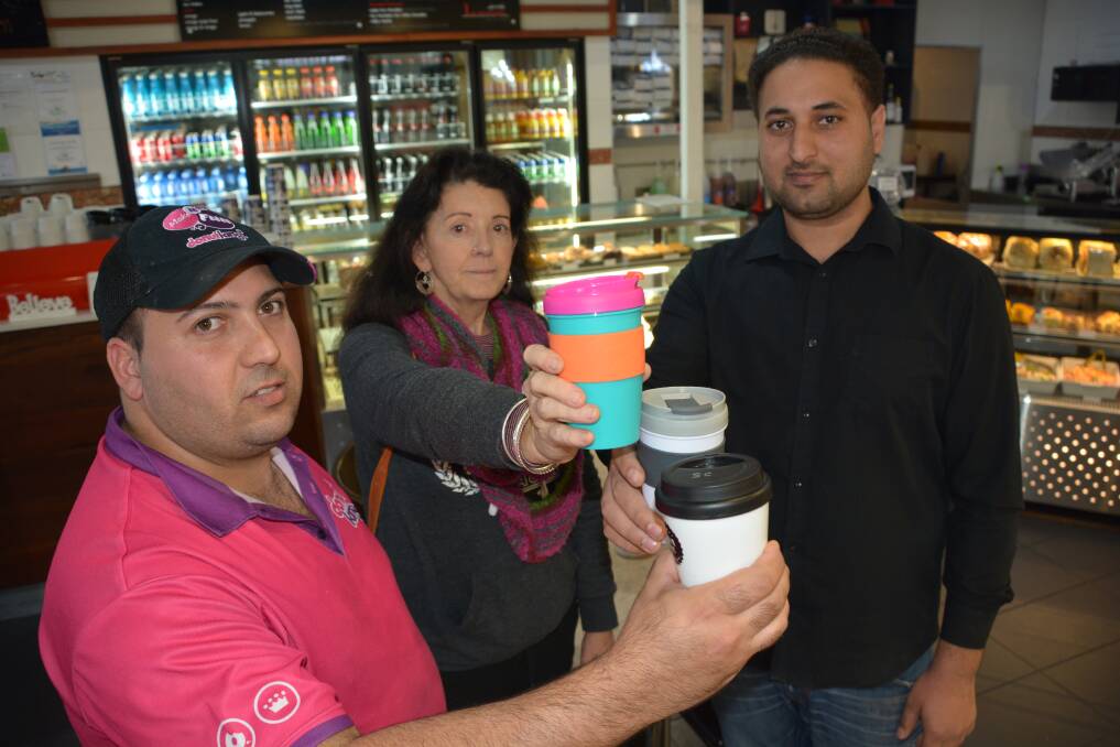 Discount coffee: Donut King owner Mick Camilleri, Winmalee Neighbourhood Centre manager Morna Colbran, La montagna cafe and deli owner Sarbjit Singh. 