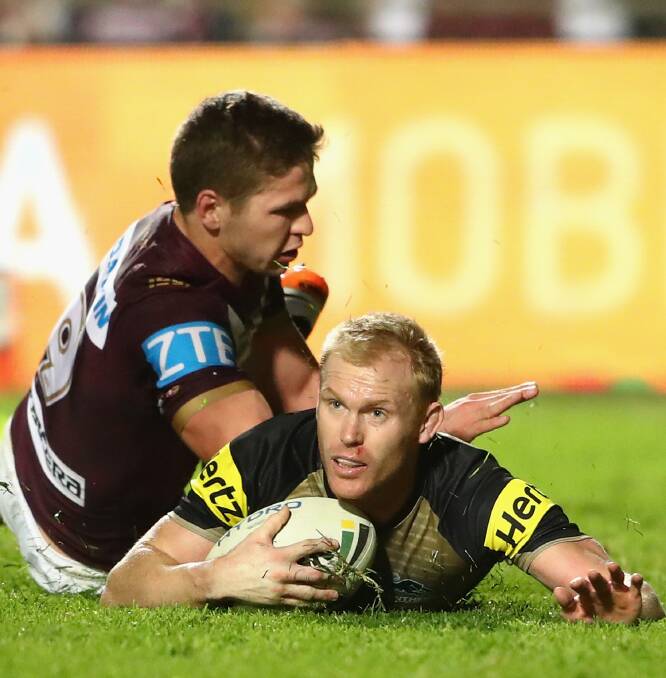 NEW DEAL: Peter Wallace has signed a new deal with the Panthers until 2018. He is pictured scoring a try against the Manly Sea Eagles in June. Photo: Getty Images