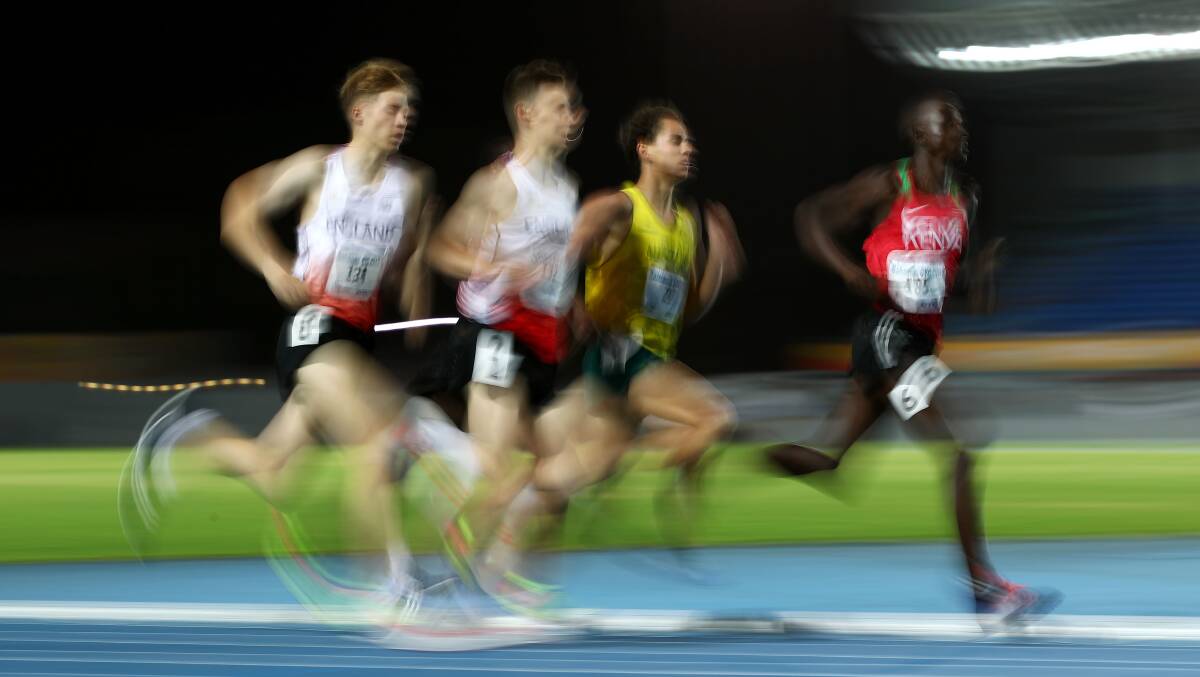 Quick as a flash: Joshua Lay and Luke Duffy of England, with Wentworth Falls runner Jackson Sharp and John Waweru of Kenya battle it out for the lead in the 1500m final at the Commonwealth Youth Games. Photo: Mark Kolbe/Getty Images