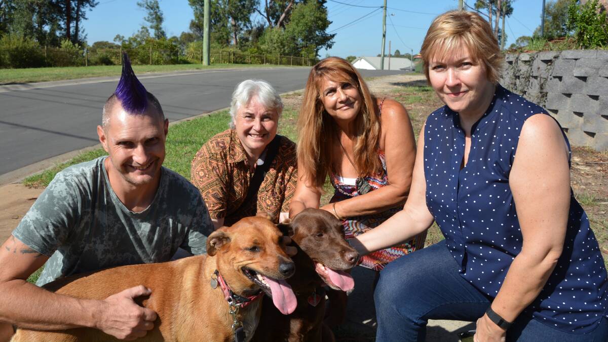 Buena Vista Rd residents Richard Astle and Fran Elston (third from left) with dogs Makeia and Milo, with Blue ARC's Jenny Bigelow and Dr Mel Taylor from Macquarie University.