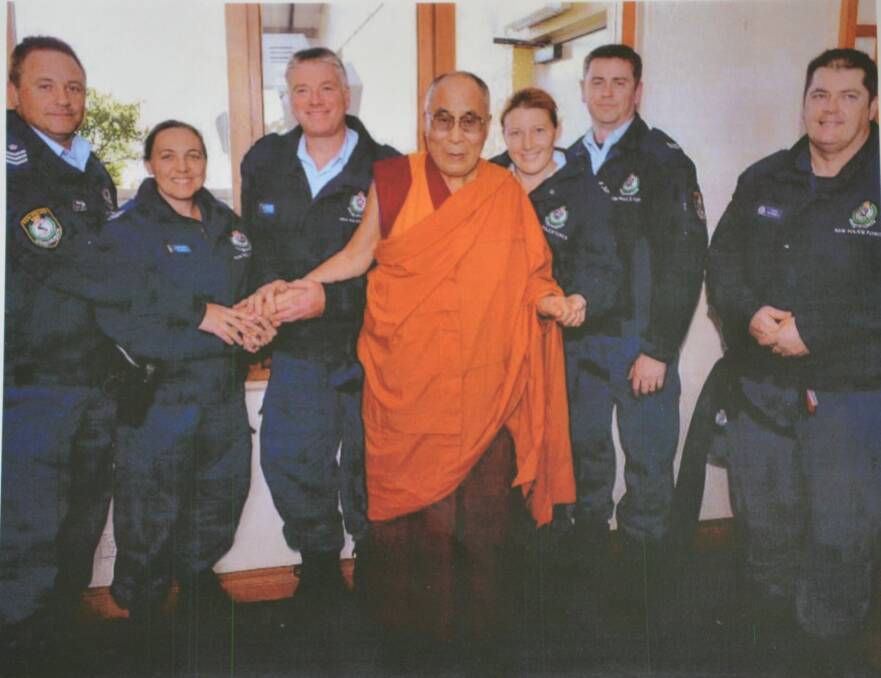 Darran Harvey (centre), pictured with colleagues, was honoured to meet the Dalai Lama in 2015.