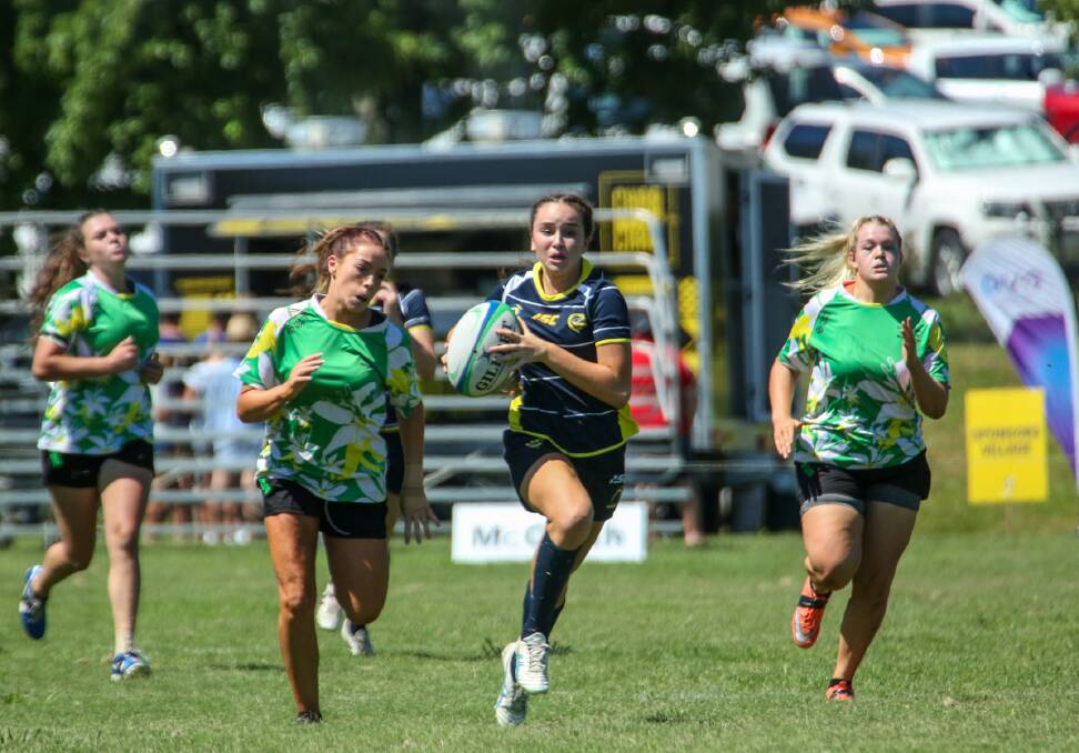 On the run: Action from the inaugural rugby sevens event at Wentworth Falls, which included a youth girls competition. This year's competition has been expanded.