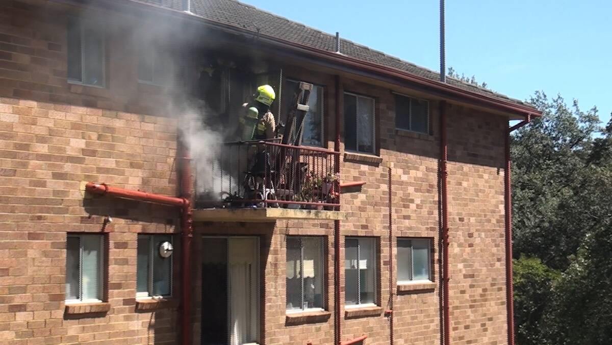 Evacuation: Residents from adjoining Boland Avenue units were evacuated, with one lady being assessed at the scene for smoke inhalation. Photo: Top Notch Viedo