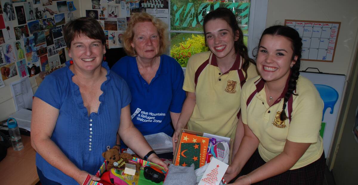 Gift of giving: Sue Campbell-Ross and Jackie Mayers with Alana Willingham and Annabelle Baddock.