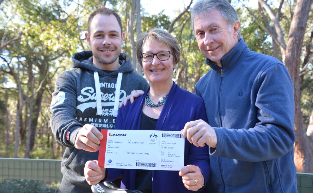 Couldn't be happier: Amanda Spratt's brother Nick, and parents Lyn and Graeme, with the cyclist's 'ticket' to the Rio Olympics.
