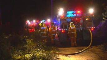 Firefighters at the fire in bushland at Katoomba on Monday night. Photo: Top Notch Video