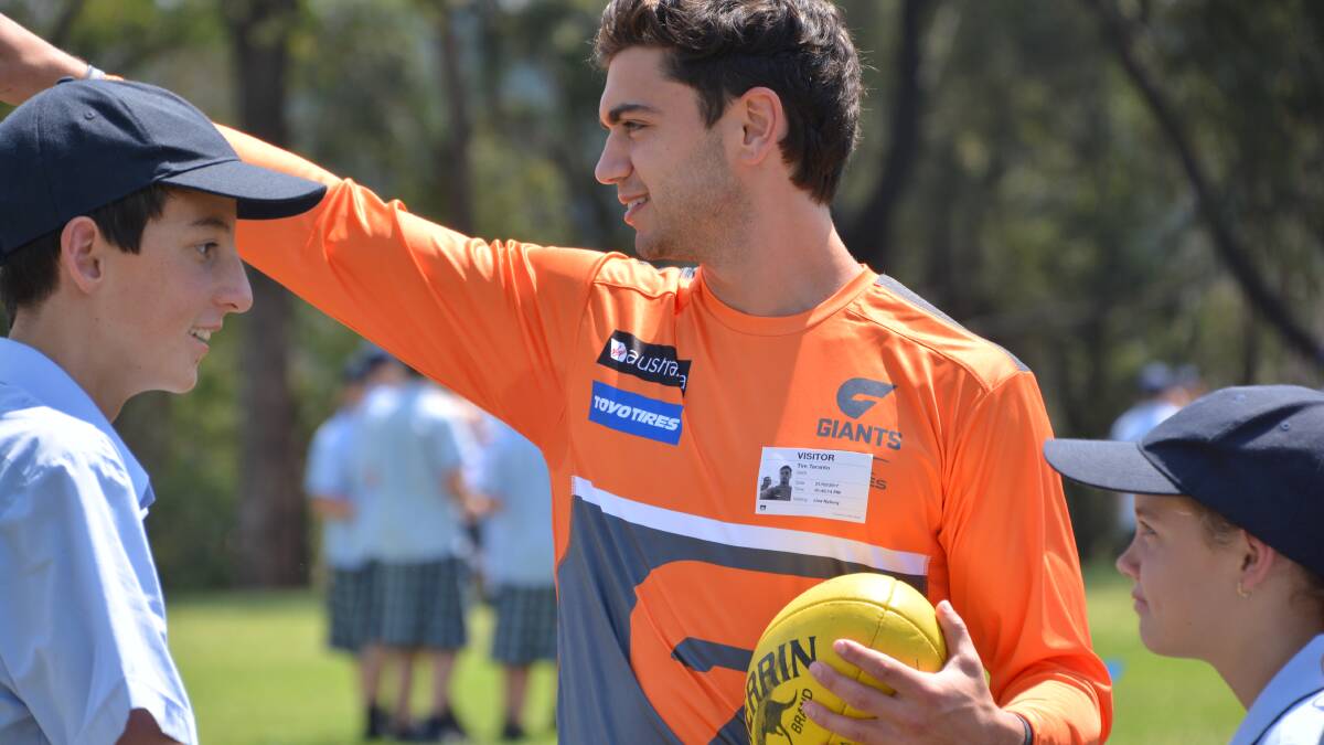 GWS Giants players Tim Taranto and Will Setterfield called into St Columba's Catholic College at Springwood on Tuesday afternoon (February 21) to talk to Year 7 students and kick the footy around.
