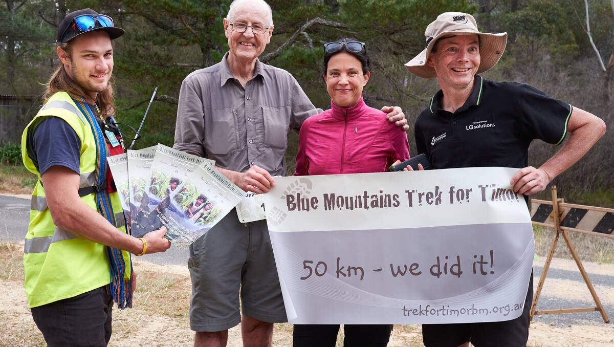 We made it: Dave Ludenia with the Upper Blueys' Don Kerr, Claudia Blumer and Ross Gurney, who completed the 50km in the fastest time.